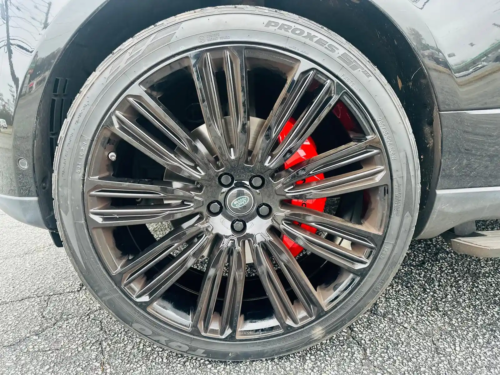 Luxury wheel showcasing professionally painted red brake calipers