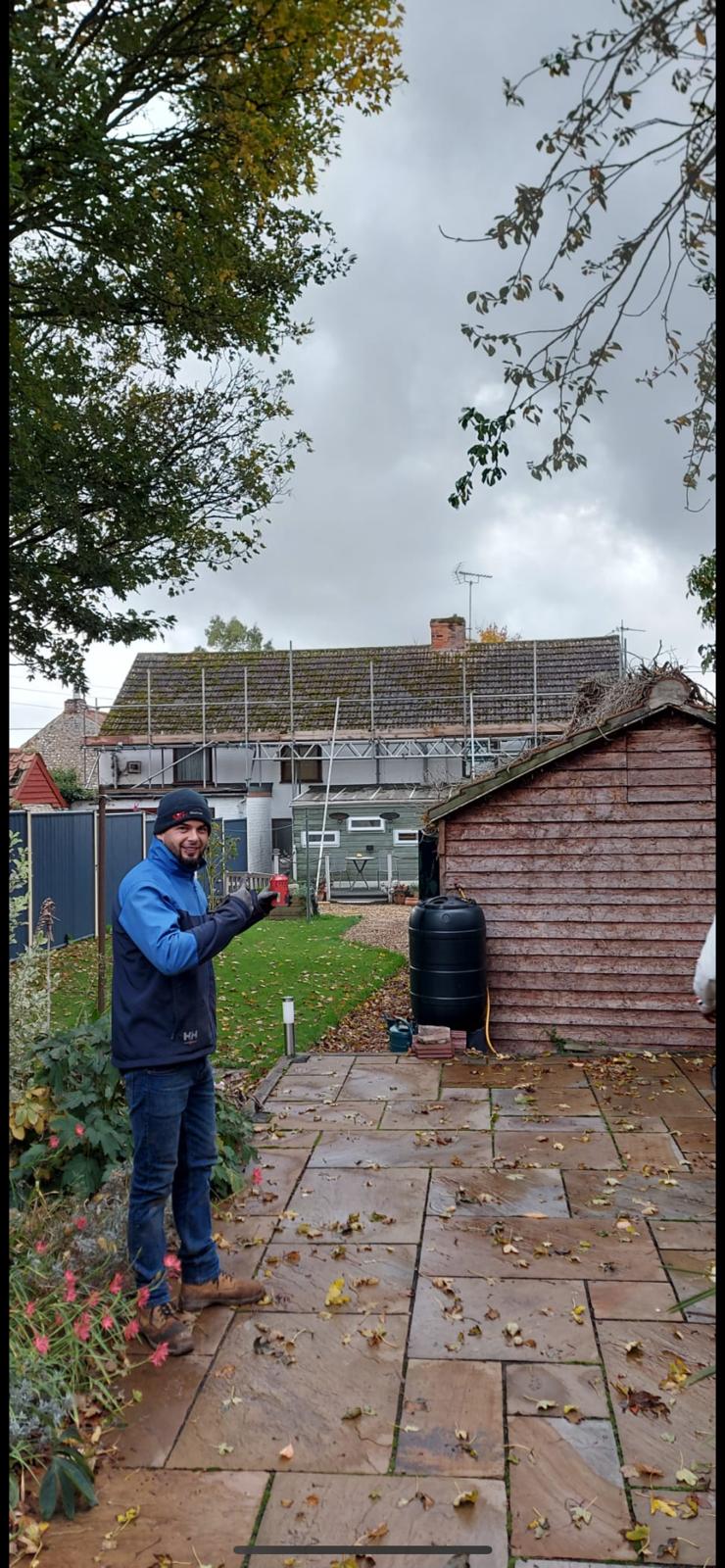 Team working on turquoise membrane roof installation - Rightway Roofing Ltd