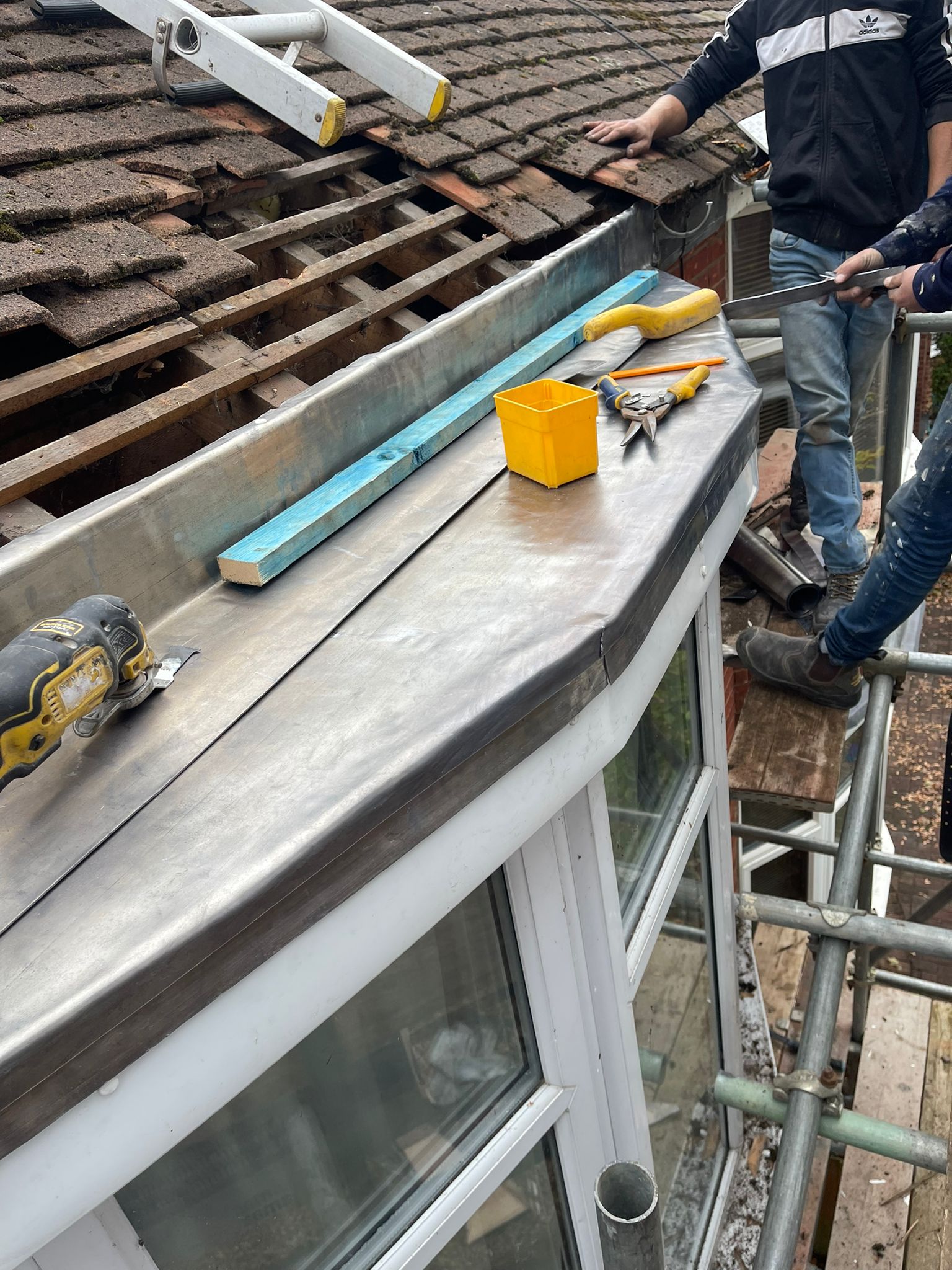 Roof repair work in progress on residential property