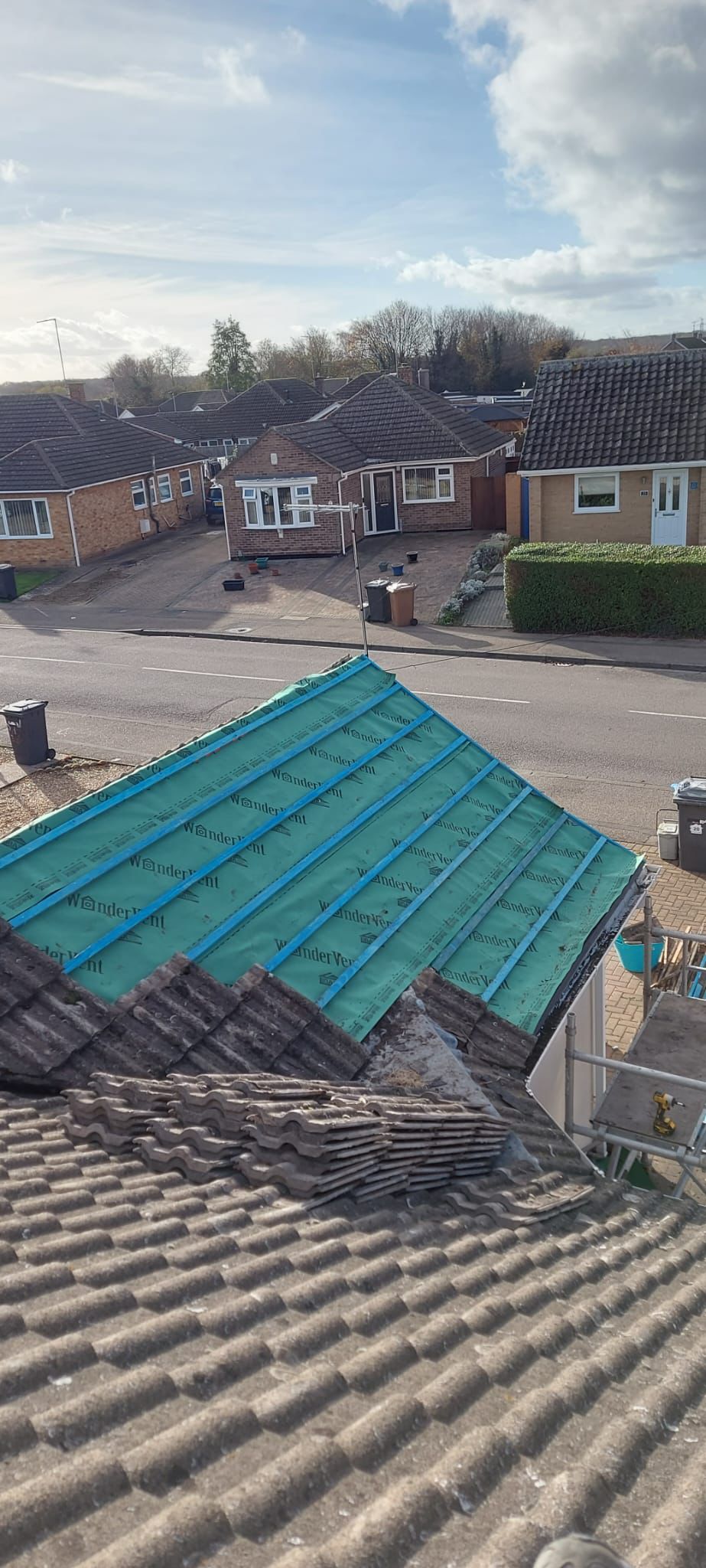 Roof underlayment installation with blue membrane - Rightway Roofing Ltd