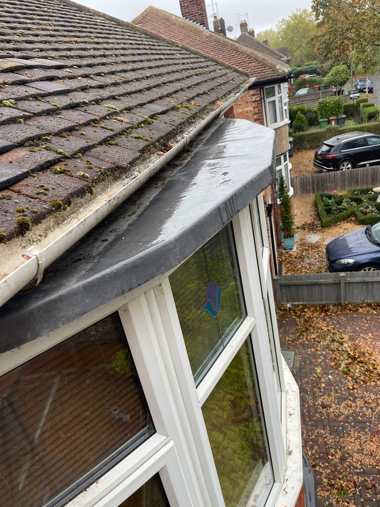 Professional gutter repair and maintenance in progress